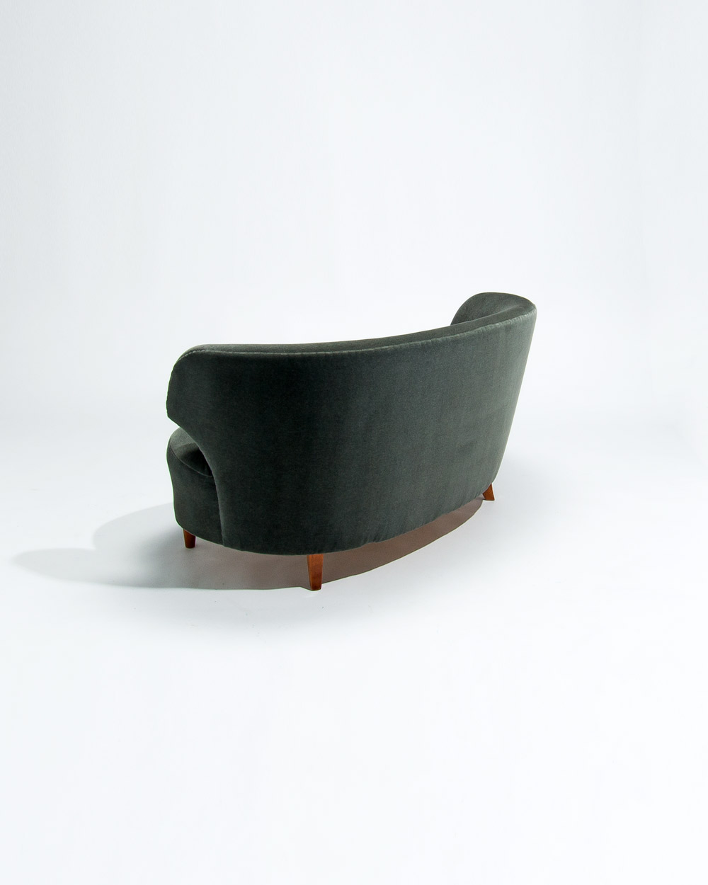 Rear view of mid century Finnish Boman sofa with sweeping curved back in green mohair