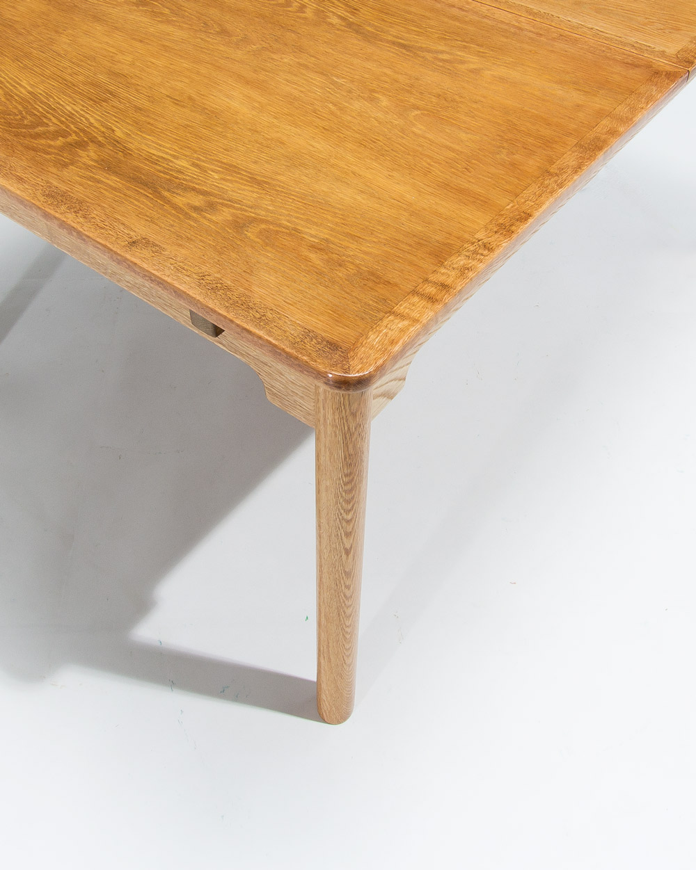 Close up of corner and oak grain detail on mid century Swedish dining table by Borge Mogensen