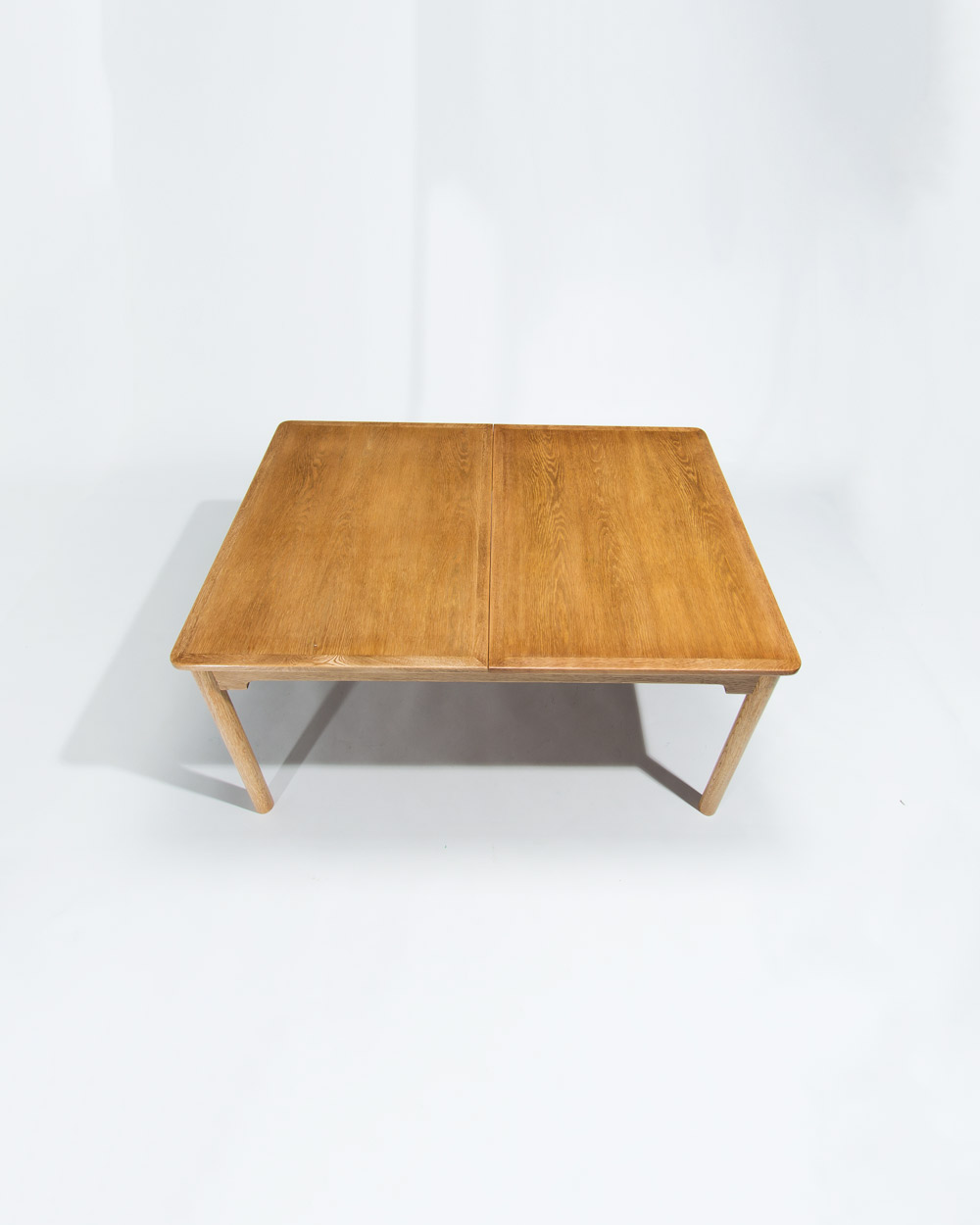 Angled view of the tabletop showing oak grain and finish on a Borge Mogensen dining table