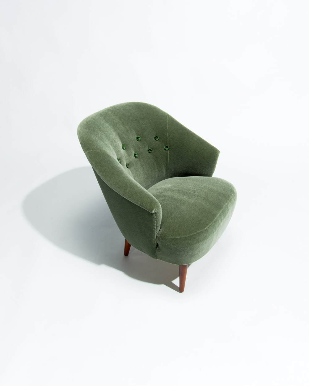 detail of the curved back on a Carl Malmsten Swedish lounge chair from the 1950s