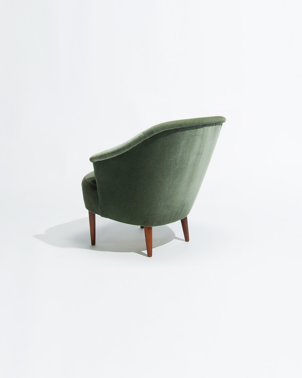 rear view of Carl Malmsten Swedish lounge chair from the 1950s showing the curved backrest
