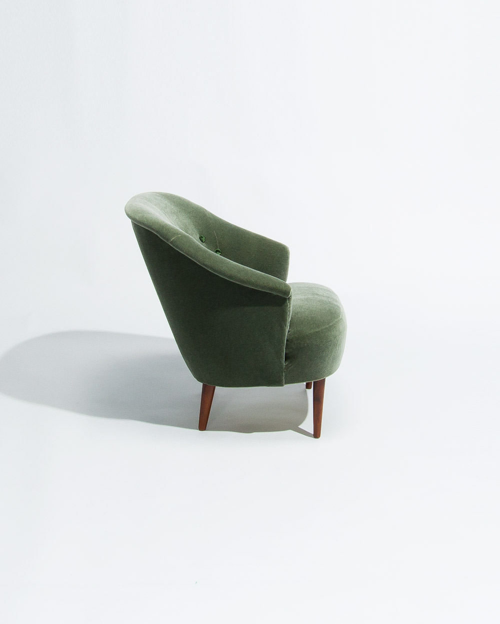 side profile of Carl Malmsten Swedish lounge chair from the 1950s in green mohair velvet upholstery