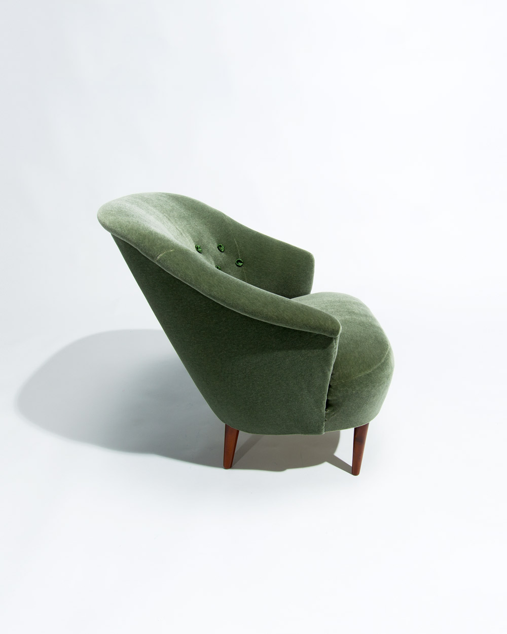 three quarter view of Carl Malmsten Swedish lounge chair upholstered in green mohair velvet by Chase Erwin