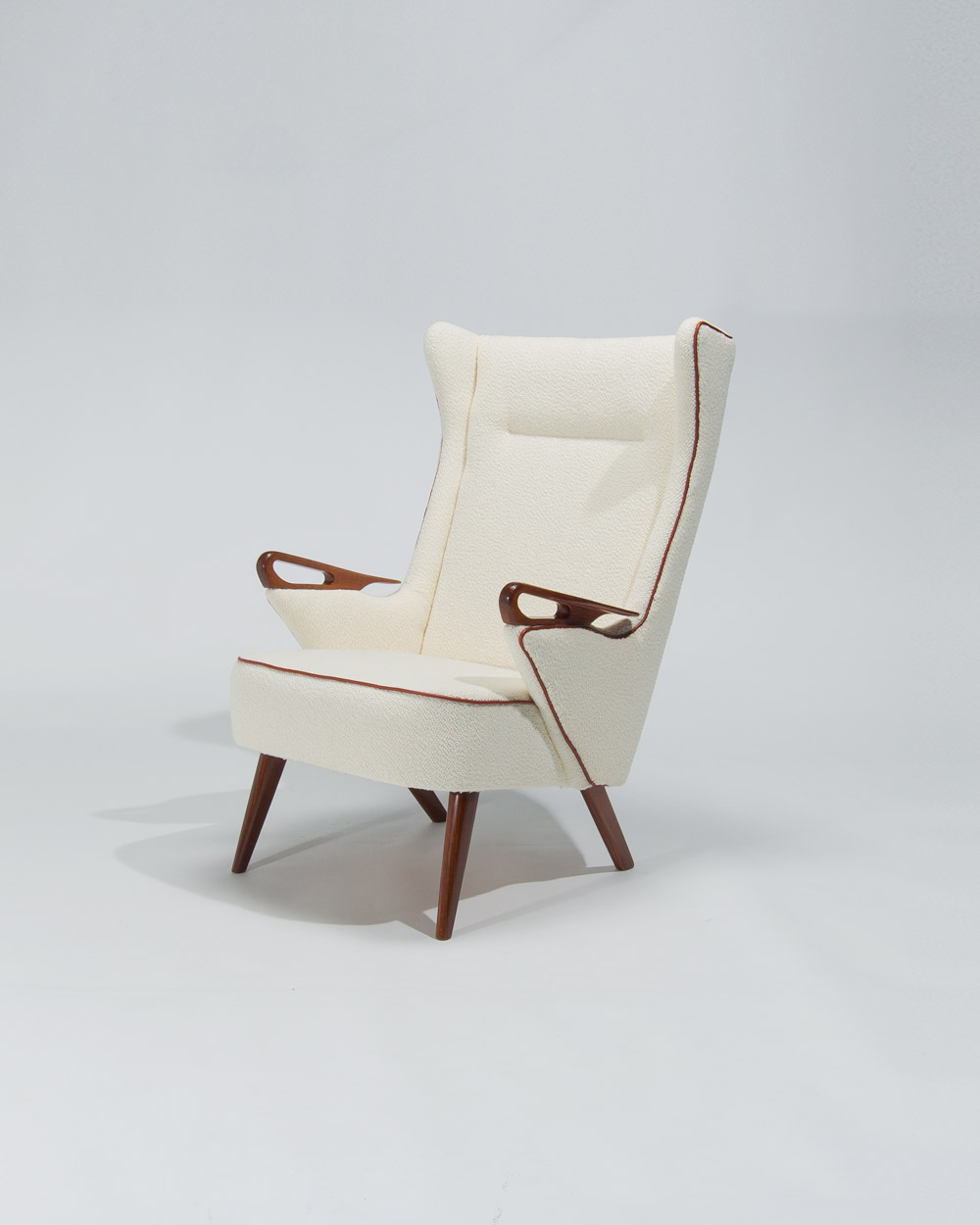 front angle high back Danish lounge chair cream boucle upholstery
