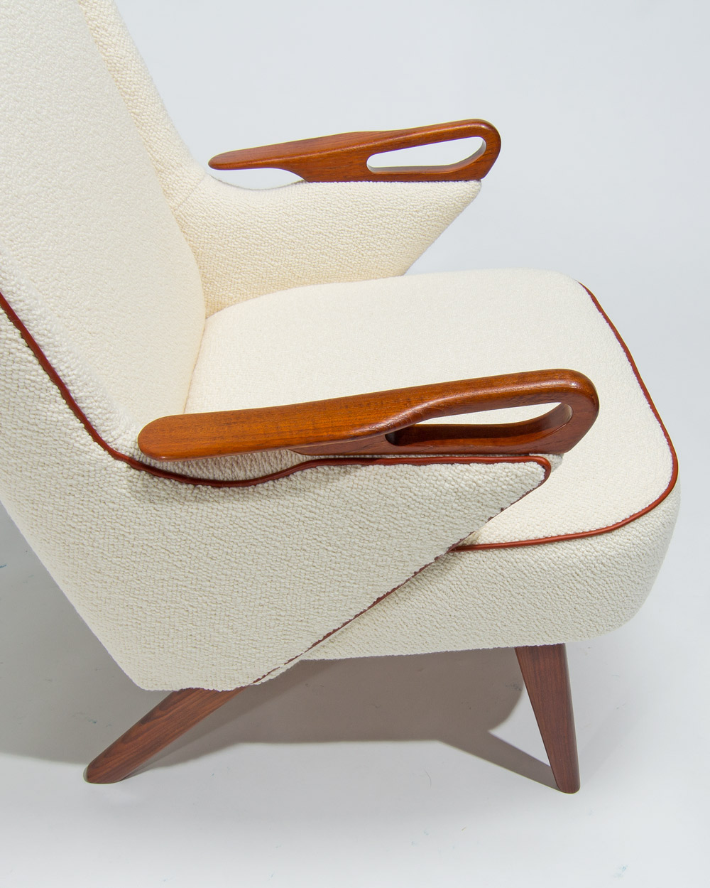teak armrest detail Danish lounge chair boucle upholstery leather piping