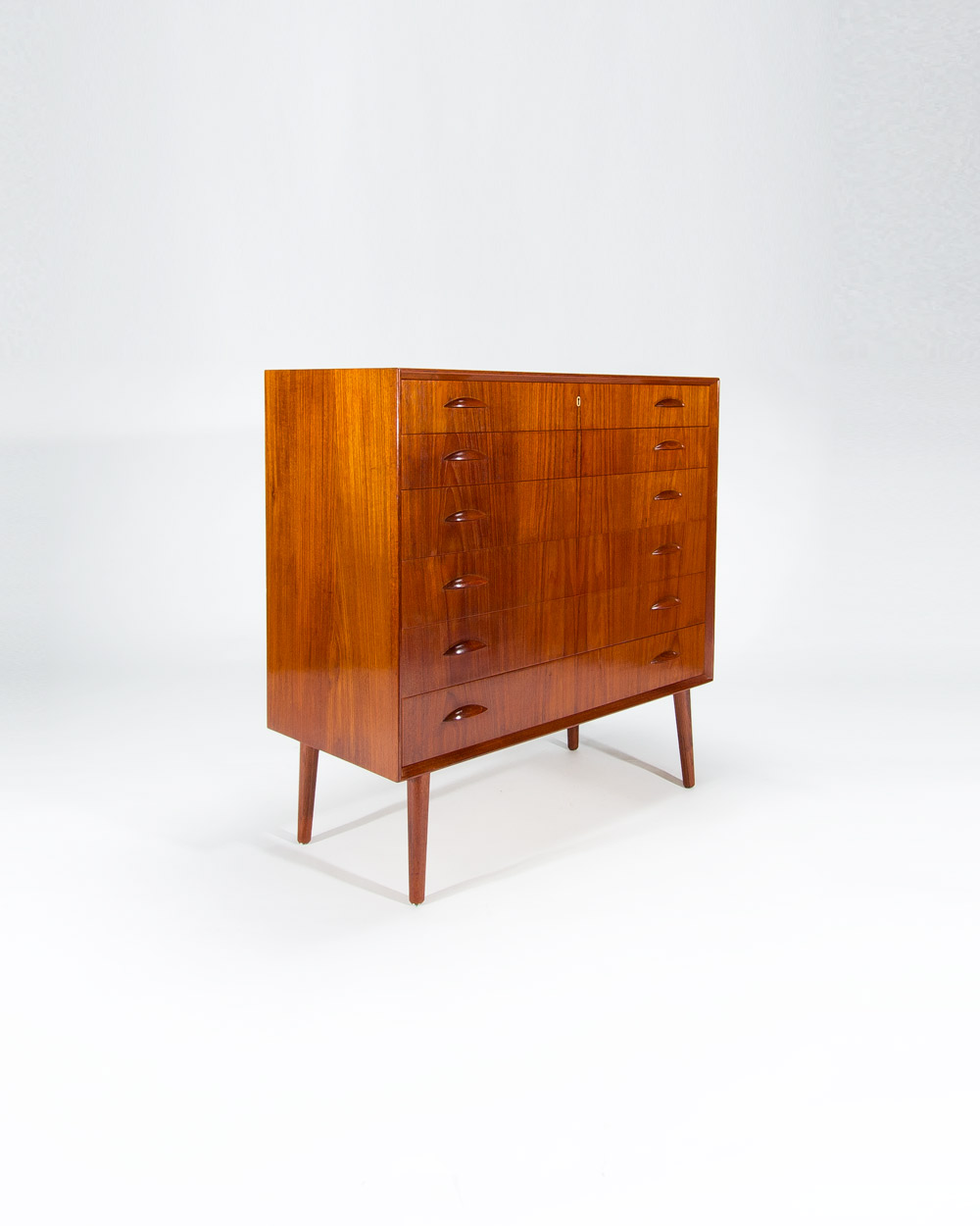 Angled view Danish teak chest of drawers 1950s showing drawer alignment and proportions