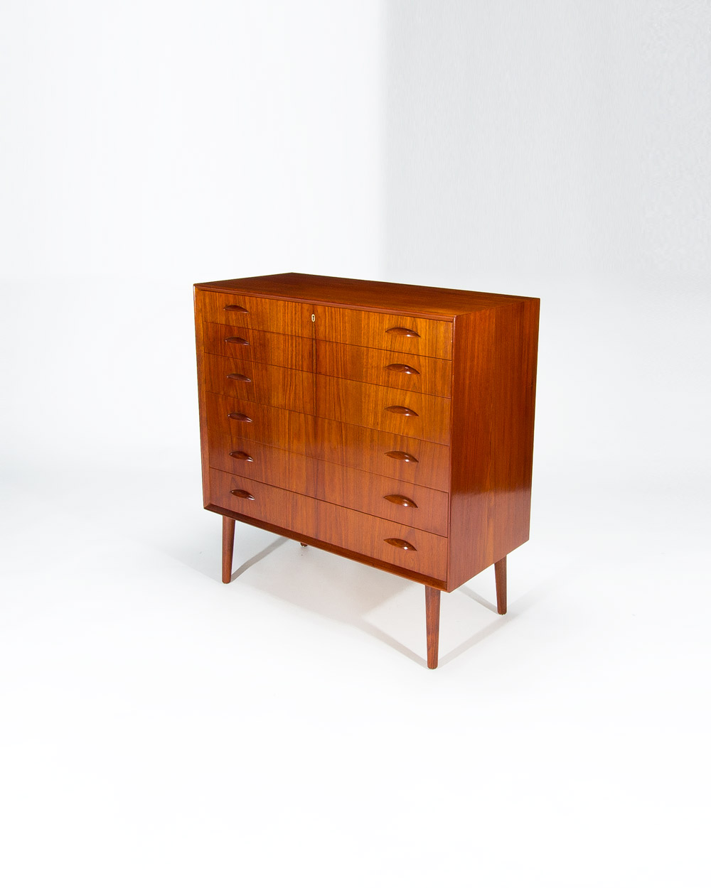 Side angle Danish teak chest of drawers 1950s showing cabinet depth and form