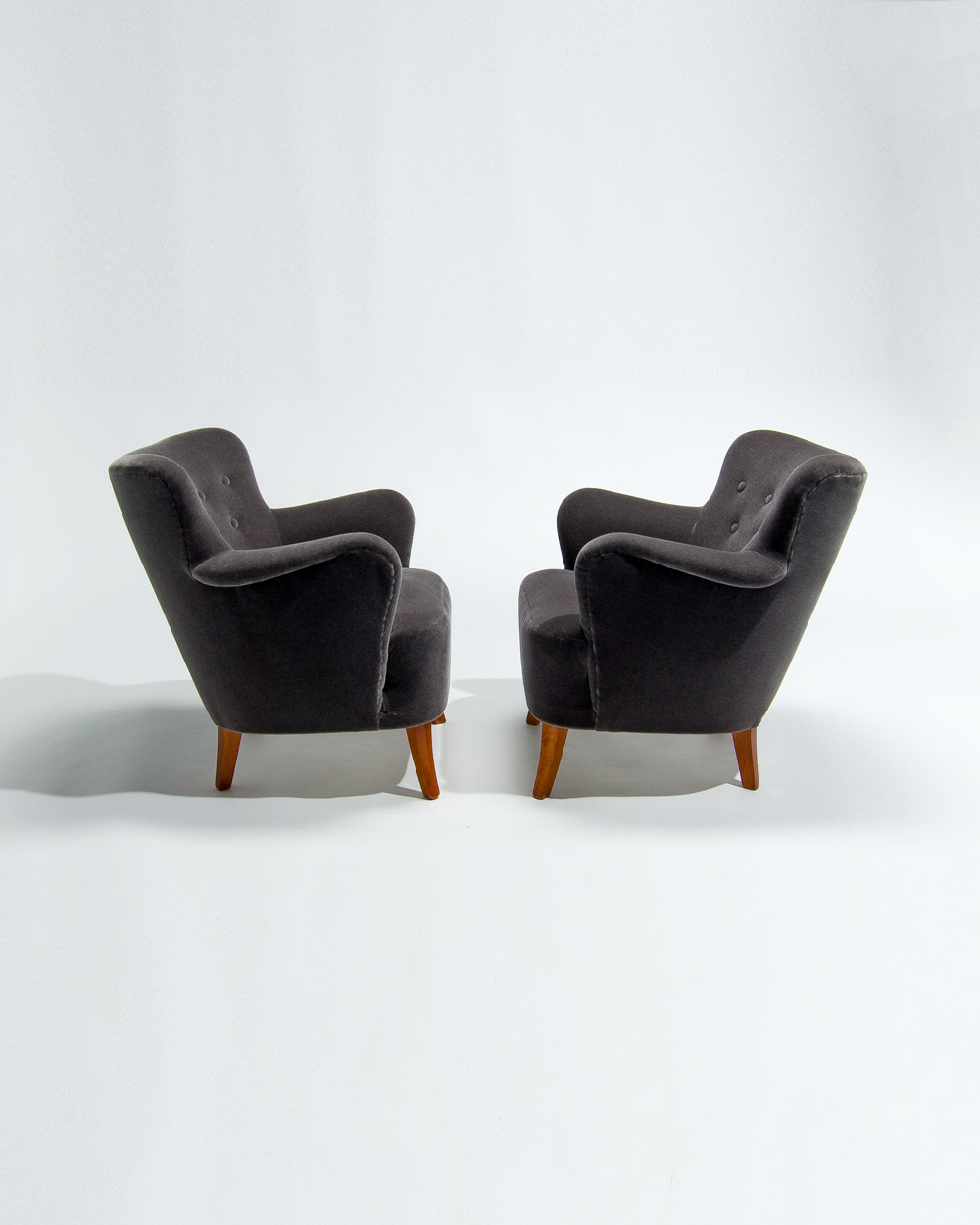 Profile of mid century Finnish armchairs in grey mohair velvet