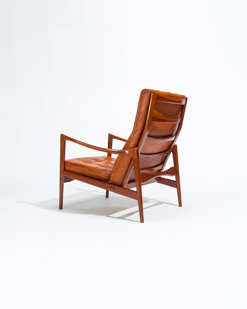 OPE lounge chair rear view showing teak frame structure and leather back