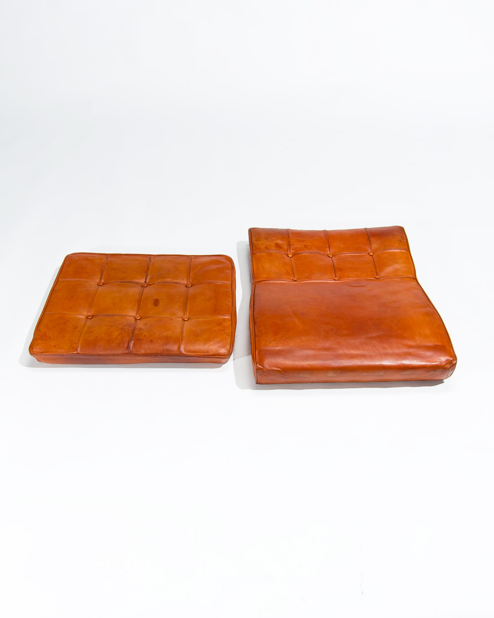 Original cognac leather cushions Ib Kofod Larsen chair showing patina