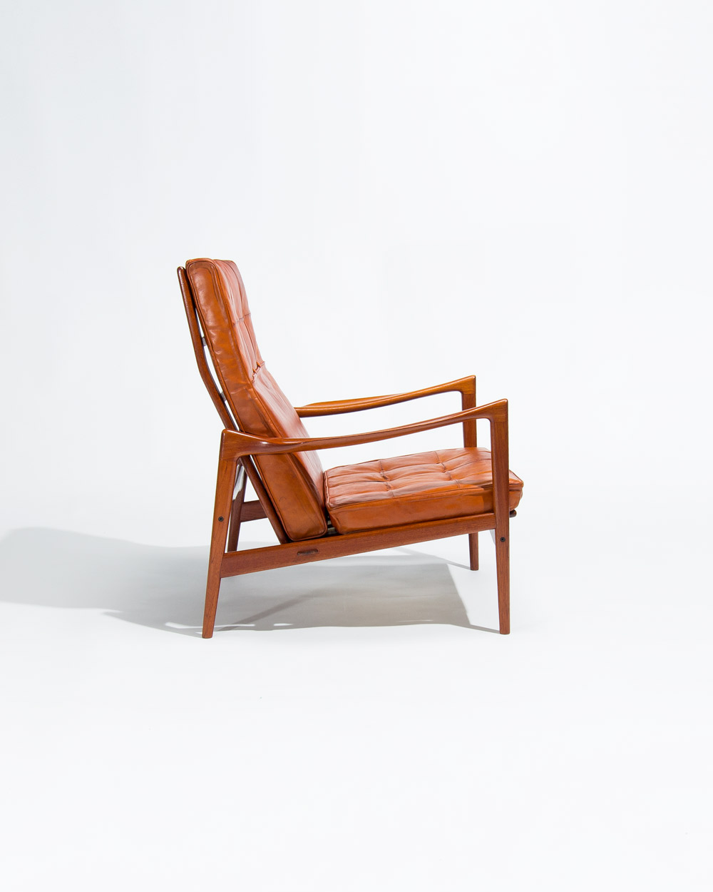 Ib Kofod Larsen high back chair side profile teak frame leather cushions
