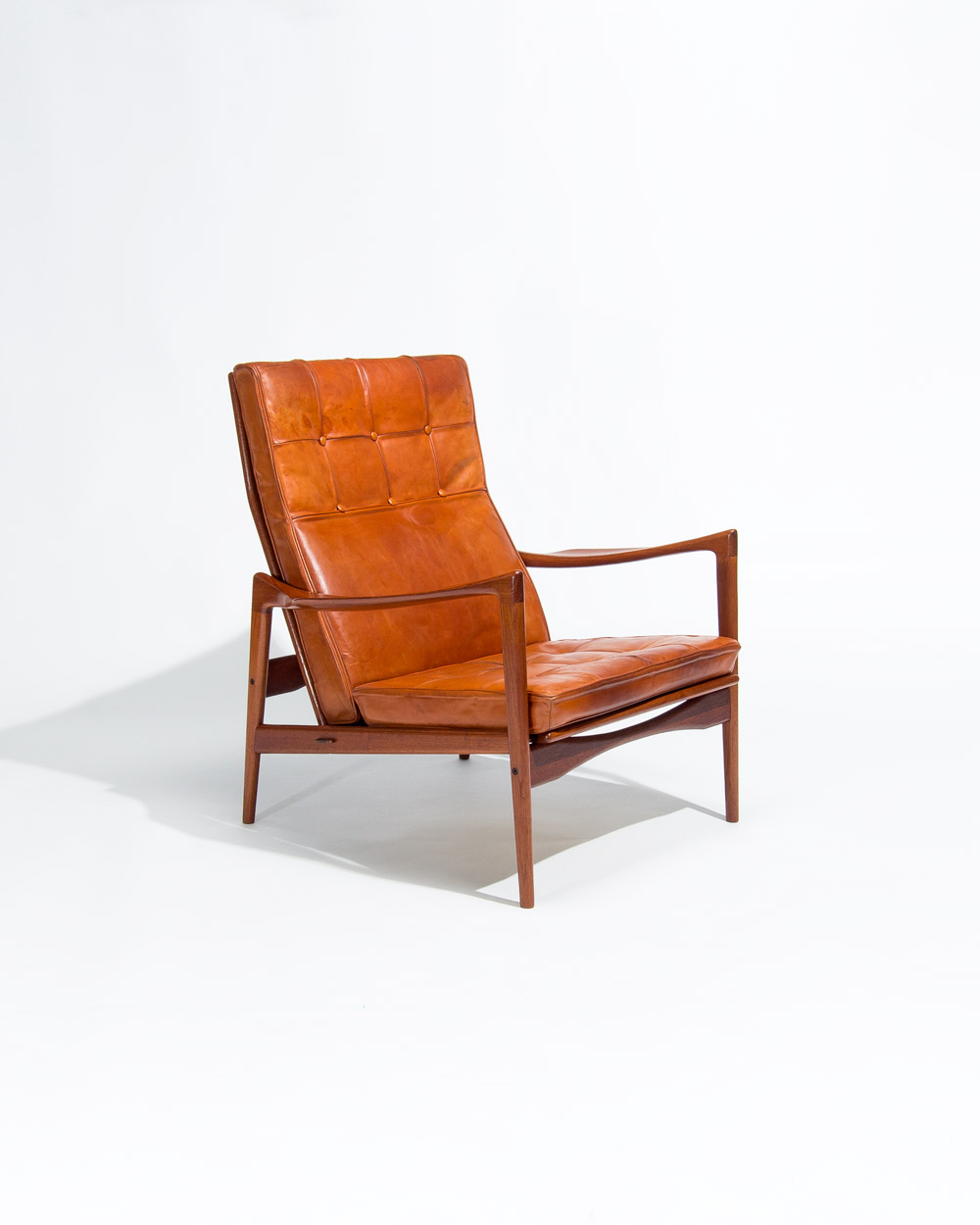 Ib Kofod Larsen OPE lounge chair teak frame cognac leather angled view