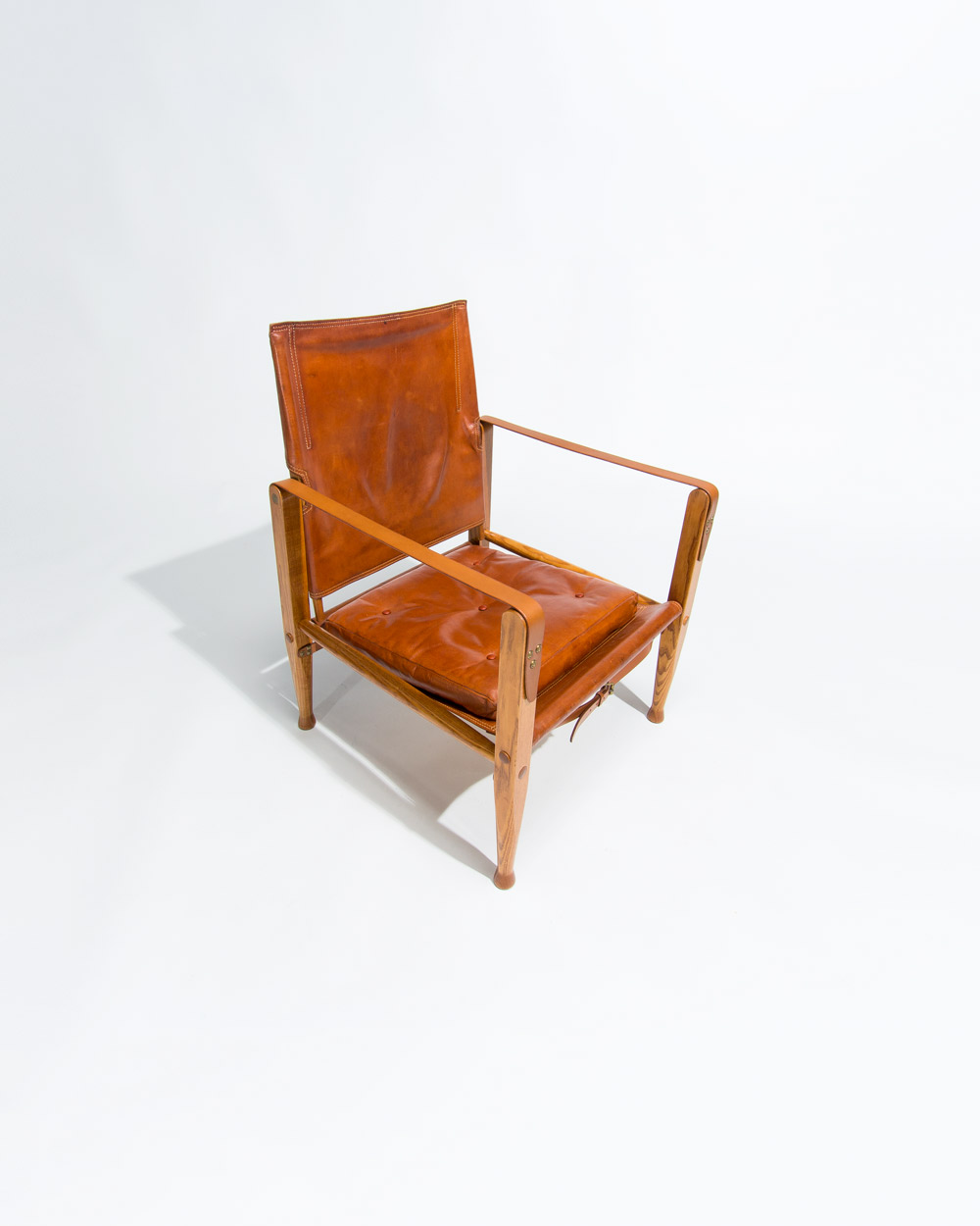 Detail of leather seat and frame of Kaare Klint Safari chair by Rud Rasmussen