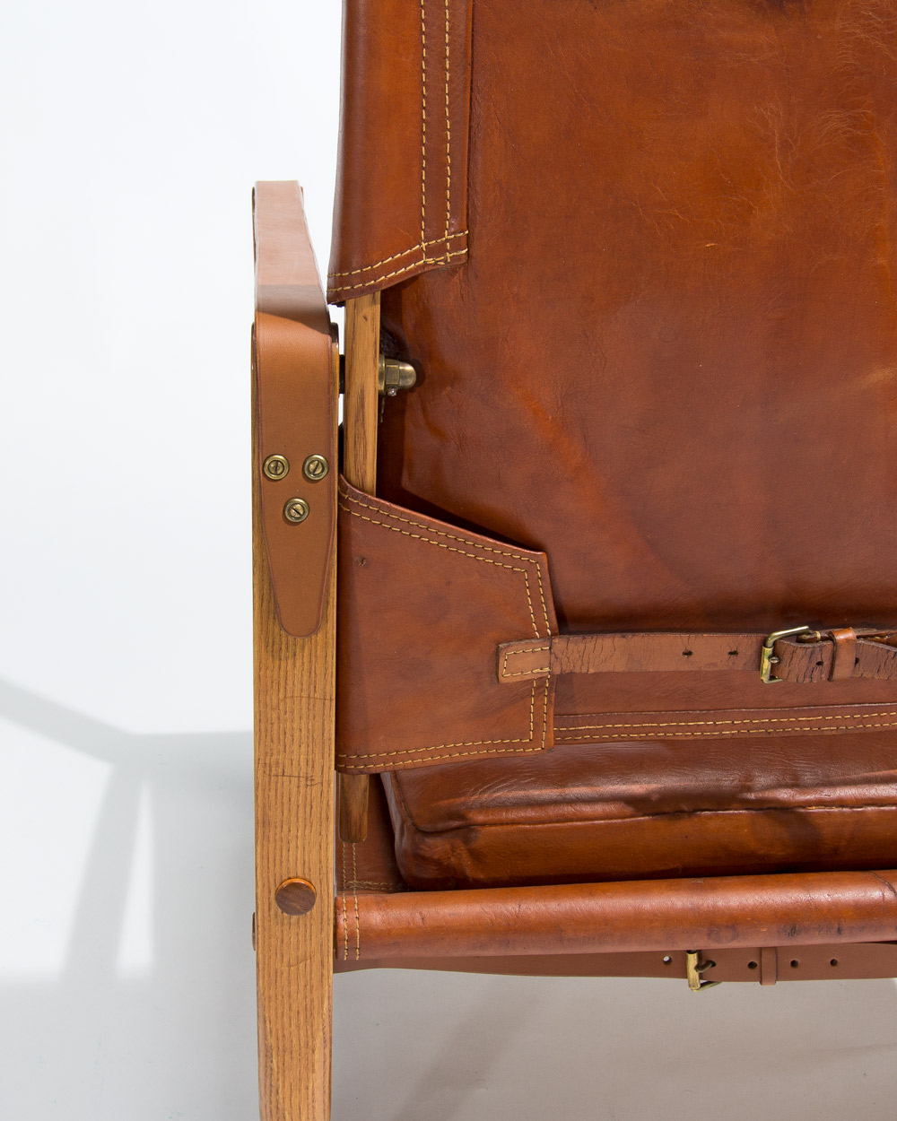 Leather strapping detail on Kaare Klint Safari chair by Rud Rasmussen